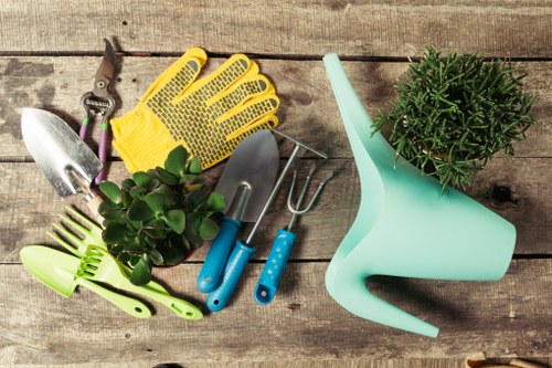 Gardener carrying out safe outdoor work in a maintained garden