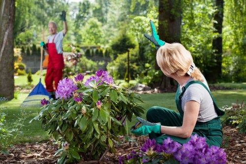 Harlington garden team using protective equipment during maintenance