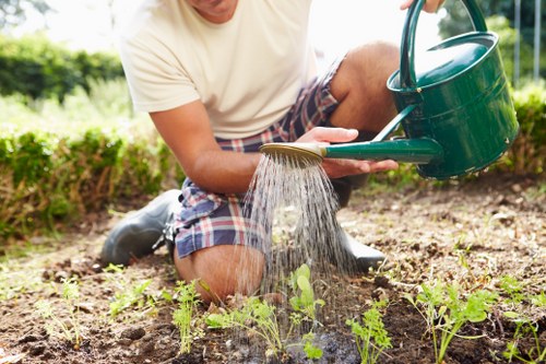 Professional gardeners in Harlington following safety procedures